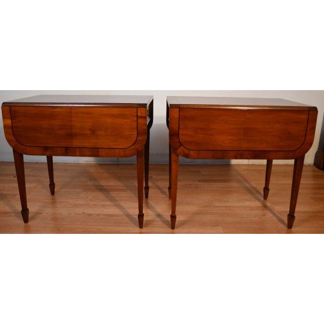 We are pleased to offer this beautiful pair of Hekman Side Tables, from the 1950s . This pair is made of Cherry wood,...