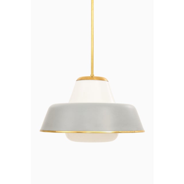 Very rare ceiling lamps model 61-347 designed by Lisa Johansson-Pape. Produced by Orno in Finland. This piece is...