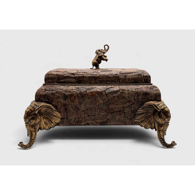 Maitland Smith decorative box. Features a coconut tree bark exterior with a hinged lid and a brass standing elephant...