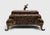 Maitland Smith decorative box. Features a coconut tree bark exterior with a hinged lid and a brass standing elephant...