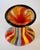 Hand-blown Badash art glass vase with multicolored vertical stripes and a black cased rim. The bold rainbow palette and...