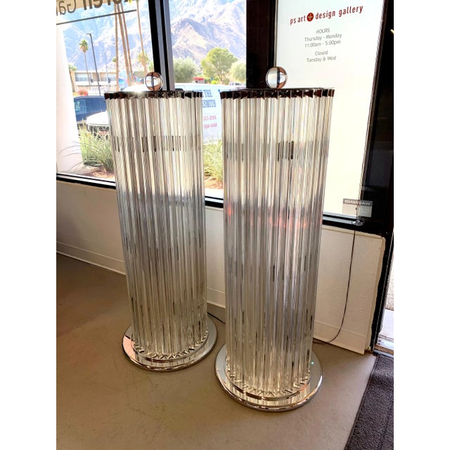 A wonderful pair of Venini Triedri glass lamps with chrome accents. These lamps each feature 8 bulbs inside and one has 32...