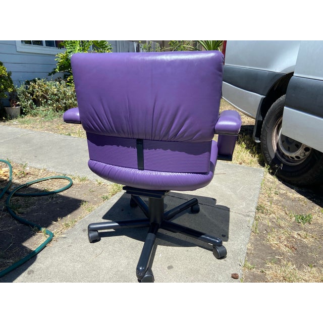 The 1990s Mario Bellini Vitra Figura Post Modern Purple Leather Desk Chair is a stunning piece of furniture that embodies...