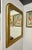 This antique French Louis Philippe mirror features gilded wood with the characteristic arch and original mirror and wood...