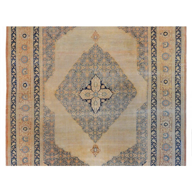 An incredible early 20th century Persian Hadji Jalili Tabriz rug with a four-lobed medallion on a larger diamond medallion...