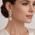 Elegant 14K yellow gold dangle earrings set with natural diamonds totaling approximately 2.50 Carat Total Weight, offering...