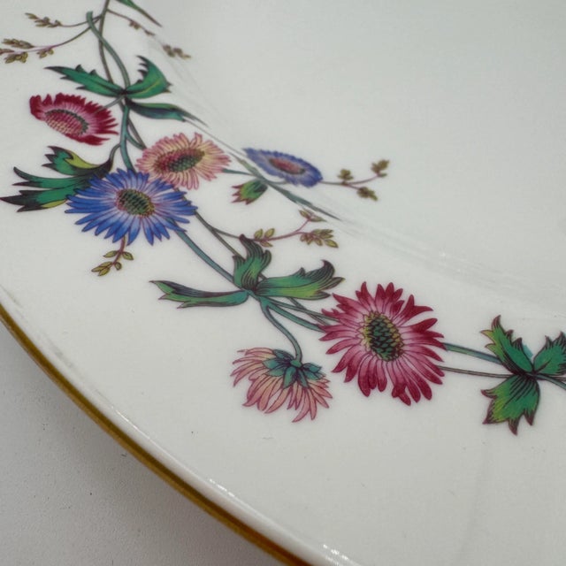 Wedgwoods Devon Sprays is a graceful dinnerware pattern accented with blue & pink flowers, long stems, and leaves. With...