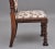 A lovely quality Regency rosewood side chair in the Gothic style, the padded high back upholstered in a decorative floral...