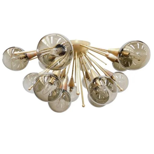 Italian sputnik flush mount with smoky Murano glass globes mounted on solid brass frame in unlacquered natural brass...