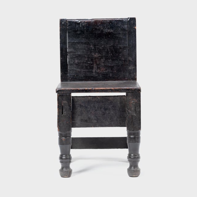 Crafted in the early 20th century, this petite Guatemalan children's chair charms with its playful asymmetry and blend of...