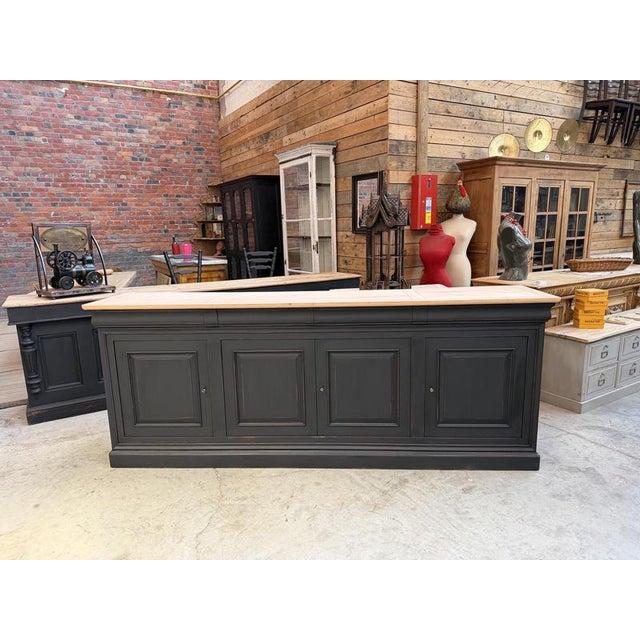 This 1970s sideboard in solid cherry wood has been fully restored. It consists of a black patinated cabinet with four...