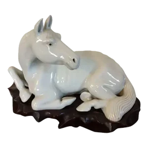 Antique Chinese Export Porcelain Blanc de Chine Model of a Recumbent Horse on Carved Wood Stand