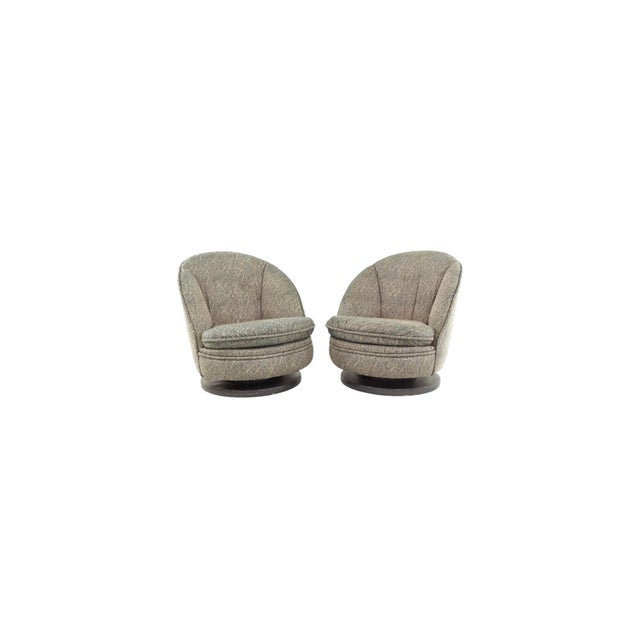Offered here is a pair of 1960s mid century modern swivel rocking accent chairs by Milo Baughman for Thayer Coggin.
