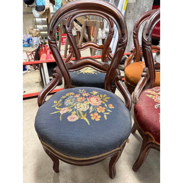 Late 19th Century Antique Victorian hand carved needlepoint parlor side chairs. Mahogany or Walnut wood. (Unsure) Belonged...