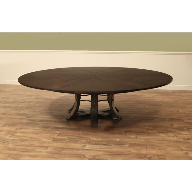 Extra-large expandable round dining table with self-storing leaves. This super-sized Jupe table measures 80 inches in...