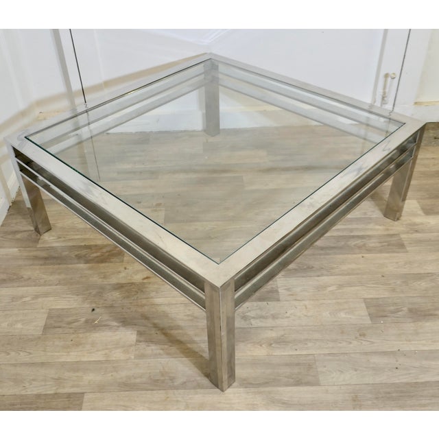 Modernist Chrome Coffee Table from the 1970s Large Mid Century Chrome and Glass Designer Coffee Table This is a stylish...
