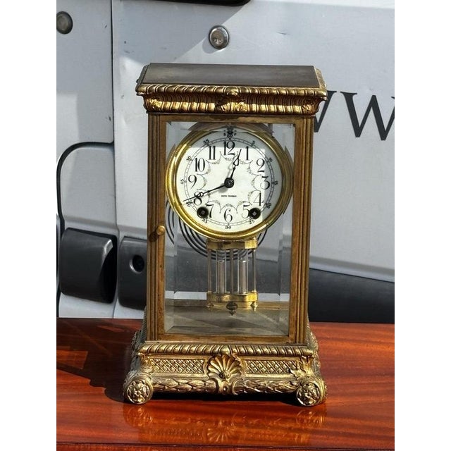 Victorian Seth Thomas Brass 4 Glass Clock, Ticking Away & Chimes On A Gong. Thick bevelled glass. When wound it's ticking...