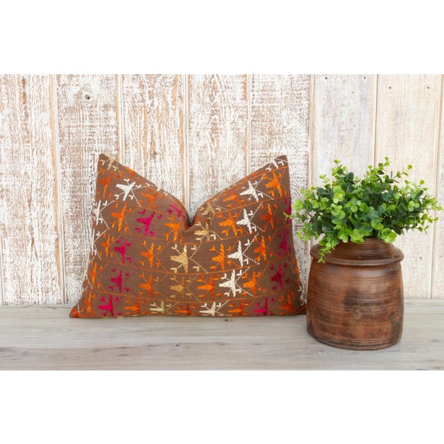 This colorful and luxurious Bagh Phulkari pillow features beautiful hand-done silk embroidery on top of a cotton fabric....