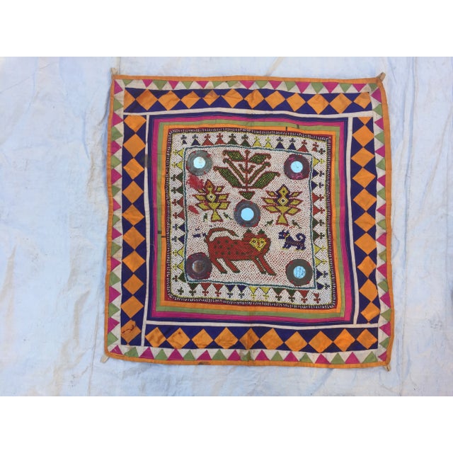 Vintage Hand-beaded Indian tribal panel with mirror accents, surrounded by chevron-striped silk originally used as a wall...