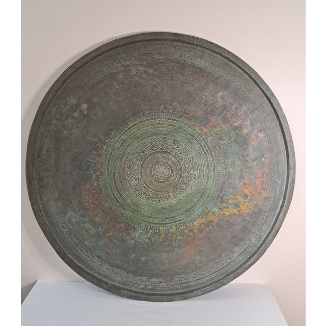 An exceptional oversized antique Turkish Ottoman copper sini tray, hand-hammered and richly hand-engraved with traditional...