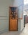 This vintage oak corner cabinet with glass doors is a beautiful example of french furniture from the interwar period:...