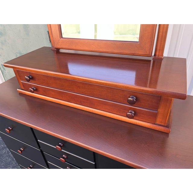 A massive, stout chest of drawers crafted by Stanley Furniture with elegant dresser top vanity mirror with drawer. This...