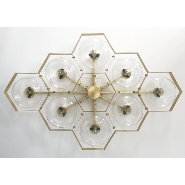 Italian midcentury flush mount with eight clear Murano glass shades mounted on solid brass frame in satin brass finish /...