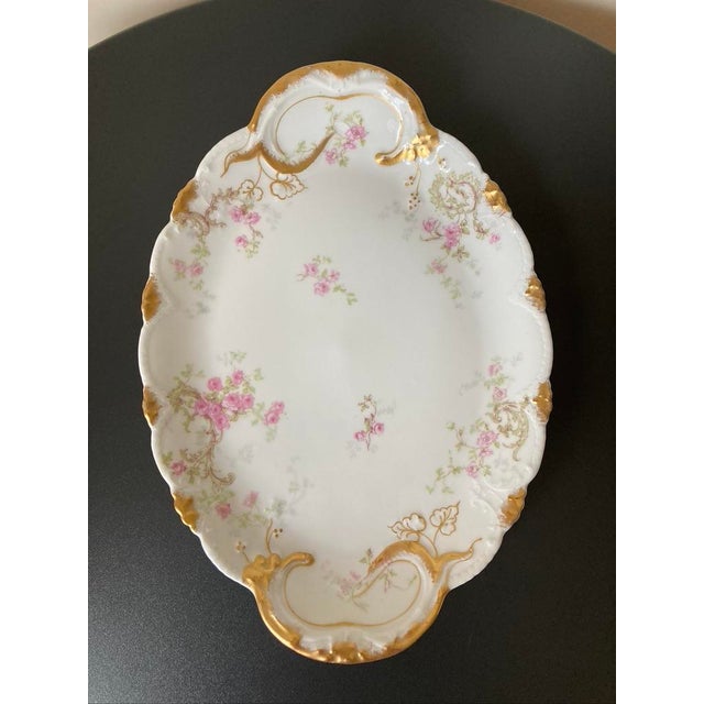 A beautiful Limoges porcelain oval tray with French roses and gold accents for serving tea or coffee, circa early 20th...