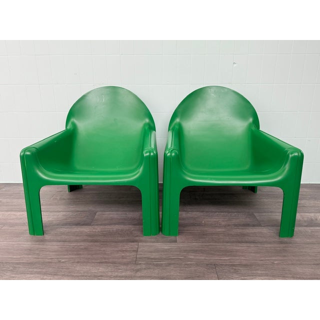 A pair of iconic Model 4794 armchairs, designed by renowned Italian designer Gae Aulenti for Kartell in 1974. This...