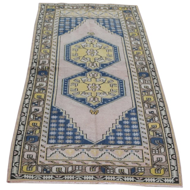 Hand-knotted with care using traditional rug-making techniques, this wool rug blends timeless craftsmanship with a modern...