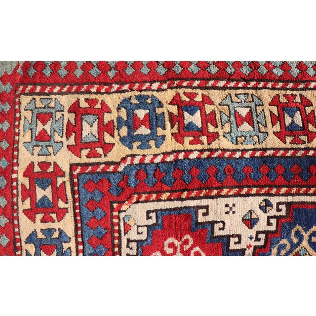 Measures: 4'6 x 6'0 Antique Moghan Caucasian Kazak Rug Showcasing Bold Geometric Medallions 4'6 x 6'0. Keivan Woven Arts/...