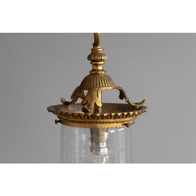 Brass framed small circular glass lantern with original chain and ceiling rose. Re-wired and tested. Circa 1900. Up to...