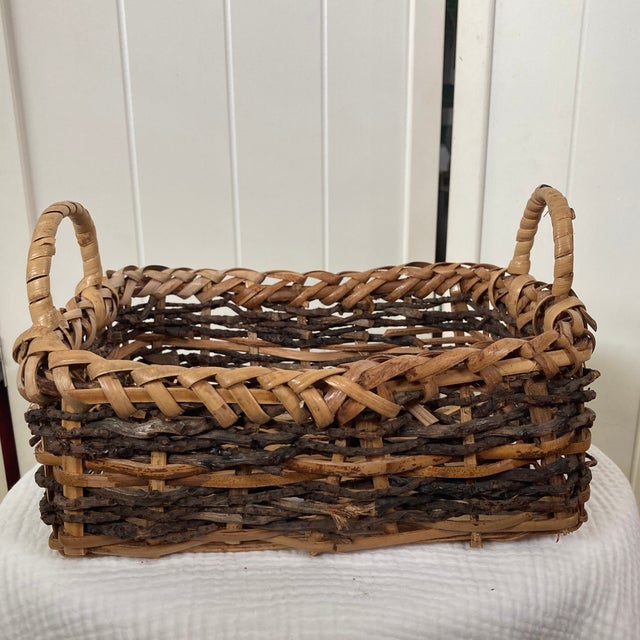 Add an authentic layer of organic texture to your space with this vintage 11-inch hand-woven rustic gathering basket....