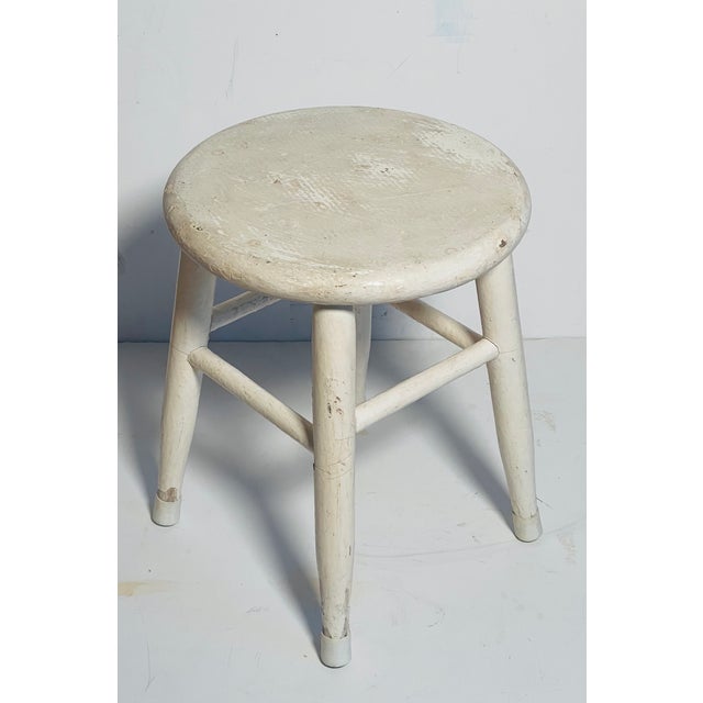Antique painted white distressed kitchen low stool on 4 legs.