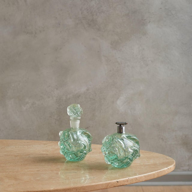 A rare hand-blown Murano glass perfume atomizer attributed to the esteemed Barovier & Toso atelier in the 1960s. Its...