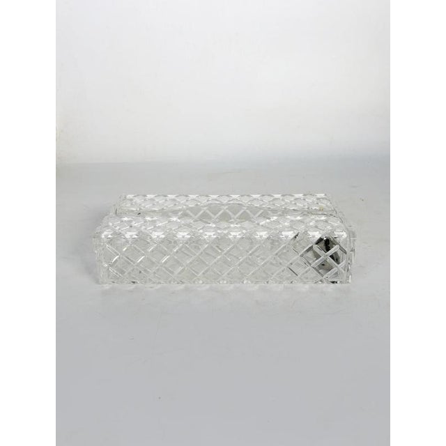 Acrylic glass tissue box, France, 1970s, with a clean and luminous design, emblematic of decorative objects of that era....