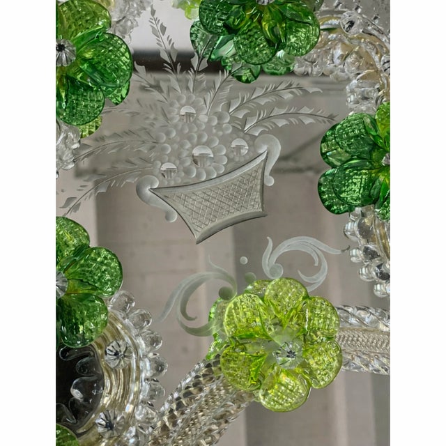 Impressive wall mirror with Murano glass style with transparent elements full of gold leaf and green flowers. Oval mirror...