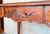20th century Louis XV style French walnut writing desk with three drawers and cabriolet legs. Created in France during the...
