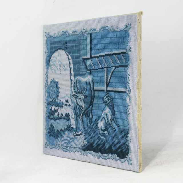 This charming vintage needlework piece features a meticulously pastoral scene rendered in a classic monochromatic blue and...