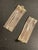 These sterling silver drop earrings feature a wide, segmented ribbon design with alternating textured and polished link...