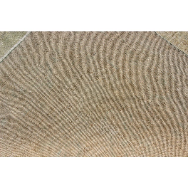 Distressed Turkish Rug With Floral Medallion in Light Green, Tan and Taupe For Sale - Image 12 of 13