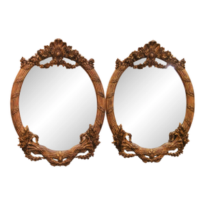 Pair of French Louis XV Style Carved Patinated Giltwood Oval Wall Mirrors