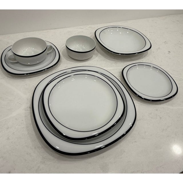 143 pieces. Not selling individual pieces. Whole set only. White with Anthracite - dark grey - pattern. This design is not...