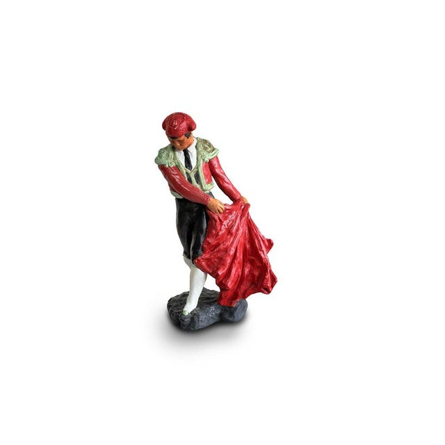 The vintage Tuscany studio bullfighter figurine embodies the essence of the traditional artistry and cultural significance...