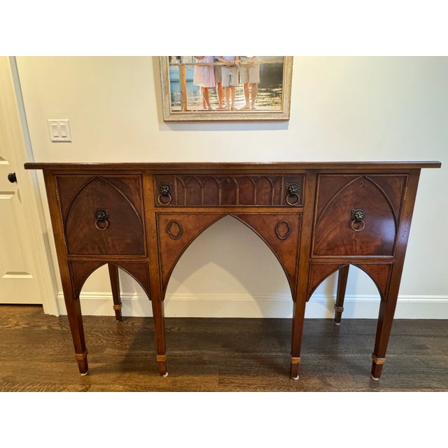 This exceptional Gothic Revival style mahogany sideboard was crafted by Stuart Swan Furniture Company of Wellesley,...