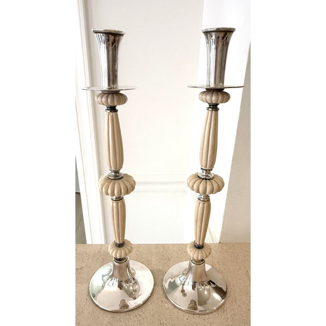 Italian made Dior candleholders. Silverplate with fluted design, which I believe to be either Bakelite or a natural...