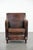We are offering this distinctive, sleekly shaped sheepskin leather designer armchair with beautiful deep colors and a...