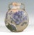 Vase in upright drum shape on an oval, flush stand, short neck piece raised at the top centre with slightly flared, raised...