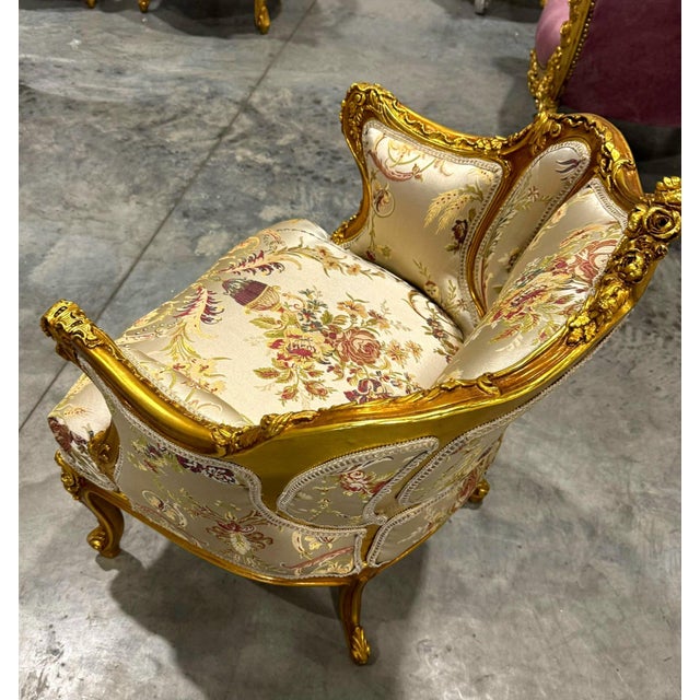 Elevate your interior with this exquisite French Rococo-style Bergère chair. Featuring a hand-carved gold leaf frame, this...
