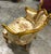 Elevate your interior with this exquisite French Rococo-style Bergère chair. Featuring a hand-carved gold leaf frame, this...